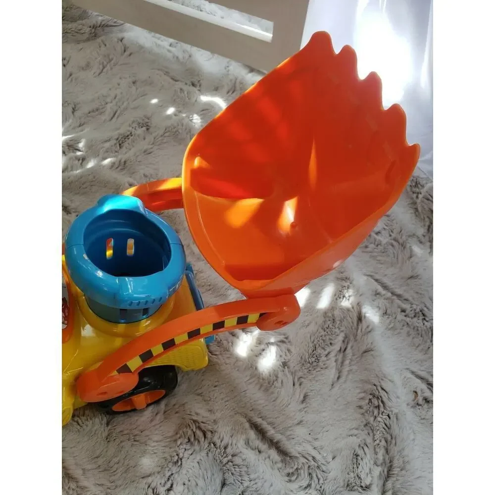 V TECH PUSH AND POP MUSICAL BULLDOZER